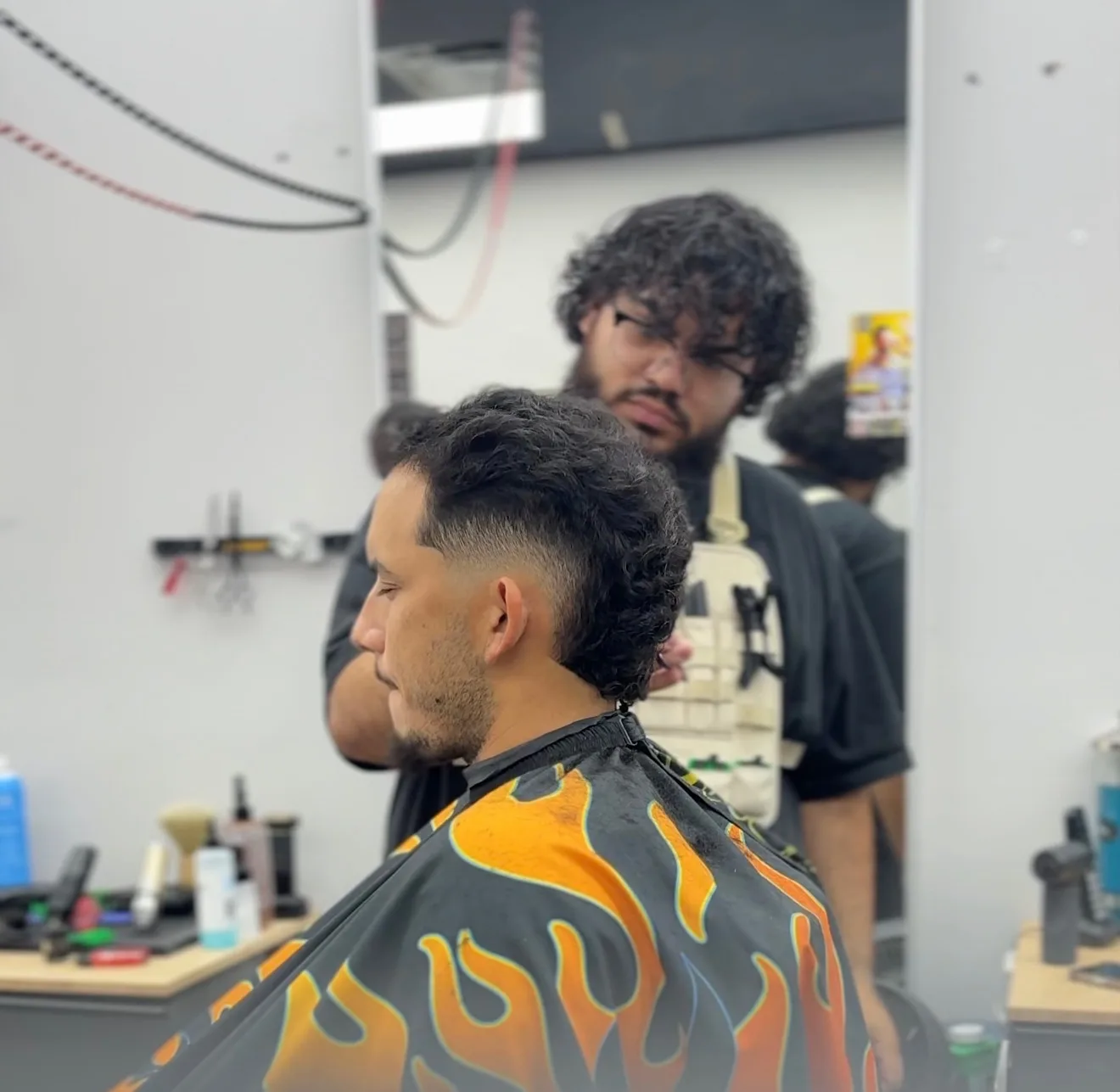 Kali working with a client in the shop